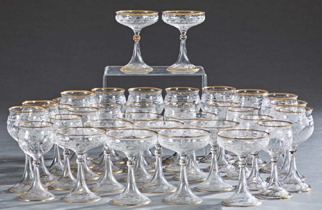 Set of Thirty-Five Gilt Rimmed Etched Crystal Wine and: Set of Thirty-Five Gilt Rimmed Etched Crystal Wine and Champagne Glasses, early 20th c., consisting of 11 white wines, 11 red wines, and 13 champagnes, Red Wine- H.- 7 in., Dia.- 3 3/8 in. (35 Pcs.) P