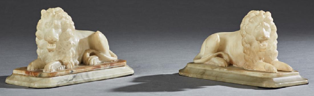 Pair of Continental Carved Alabaster Recumbent Lion: Pair of Continental Carved Alabaster Recumbent Lion Figures, late 19th c., on integral octagonal bases, H.- 6 3/8 in., W.- 11 1/2 in., D.- 5 1/4 in. Provenance: Estate of Dr. Carroll Ball, Jackson, Mi