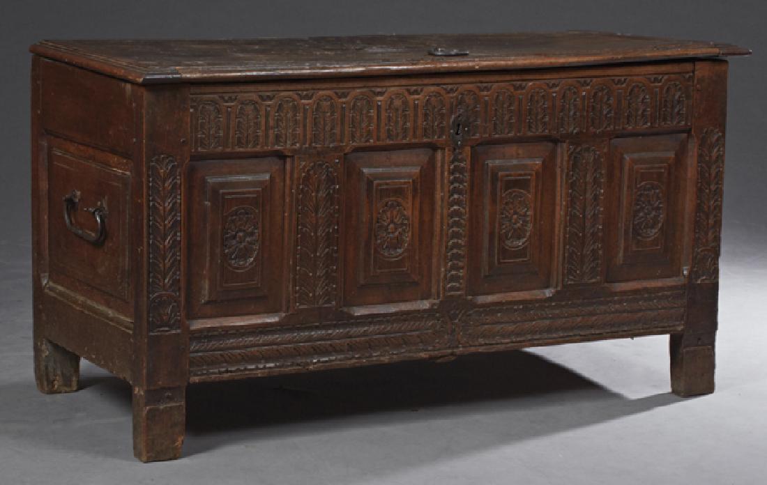 French Renaissance Style Carved Oak and Walnut Coffer,: French Renaissance Style Carved Oak and Walnut Coffer, c. 1760, the lifting lid to an interior with a candle box over an acanthus carved front, flanking four carved fielded panels, with an iron handle