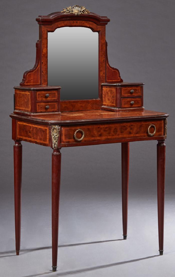 French Louis XVI Style Inlaid Ormolu Mounted Burled: French Louis XVI Style Inlaid Ormolu Mounted Burled Walnut Dressing Table, early 20th c., the arched beveled mirror with an ormolu crest, flanked by two small drawers on each side, on a stepped rounde