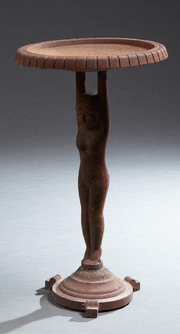 Cast Iron Bird Bath, 20th/21st c., the circular reeded: Cast Iron Bird Bath, 20th/21st c., the circular reeded edge top, on a nude female figural support, to a stepped circular base on tripodal feet, H.- 26 3/4 in., Dia.- 15 1/4 in.