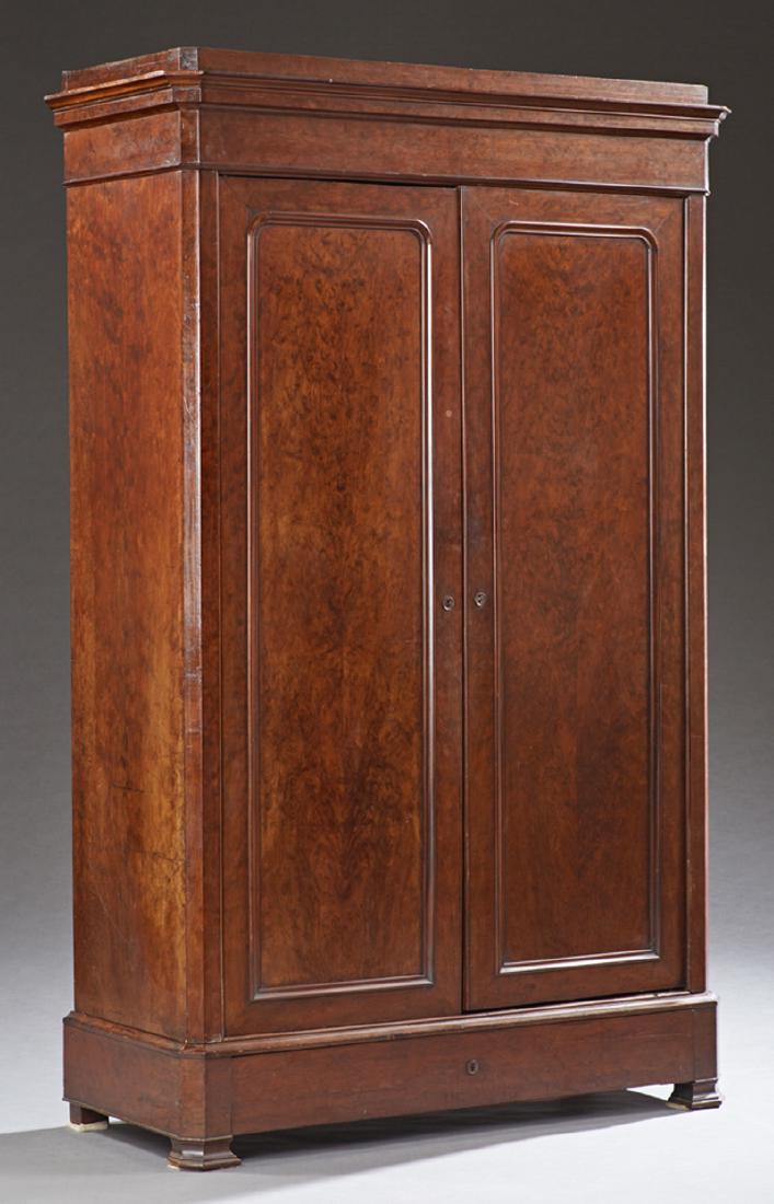 French Louis Philippe Carved Mahogany Armoire, c. 1880,: French Louis Philippe Carved Mahogany Armoire, c. 1880, the canted corner ogee crown above double doors, on a plinth base with a "secret" drawer on ogee bracket feet, H.- 82 1/2 in., W.- 54 in., D.- 2
