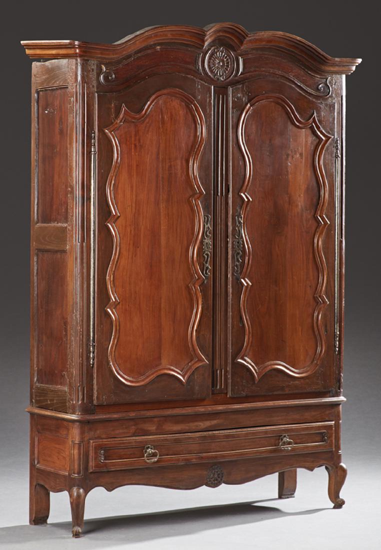 French Louis XV Style Carved Walnut Armoire, 19th c.,: French Louis XV Style Carved Walnut Armoire, 19th c., the arched stepped crown over double arched doors with steel escutcheons and long steel fiche hinges, above a long drawer, on cabriole legs with s