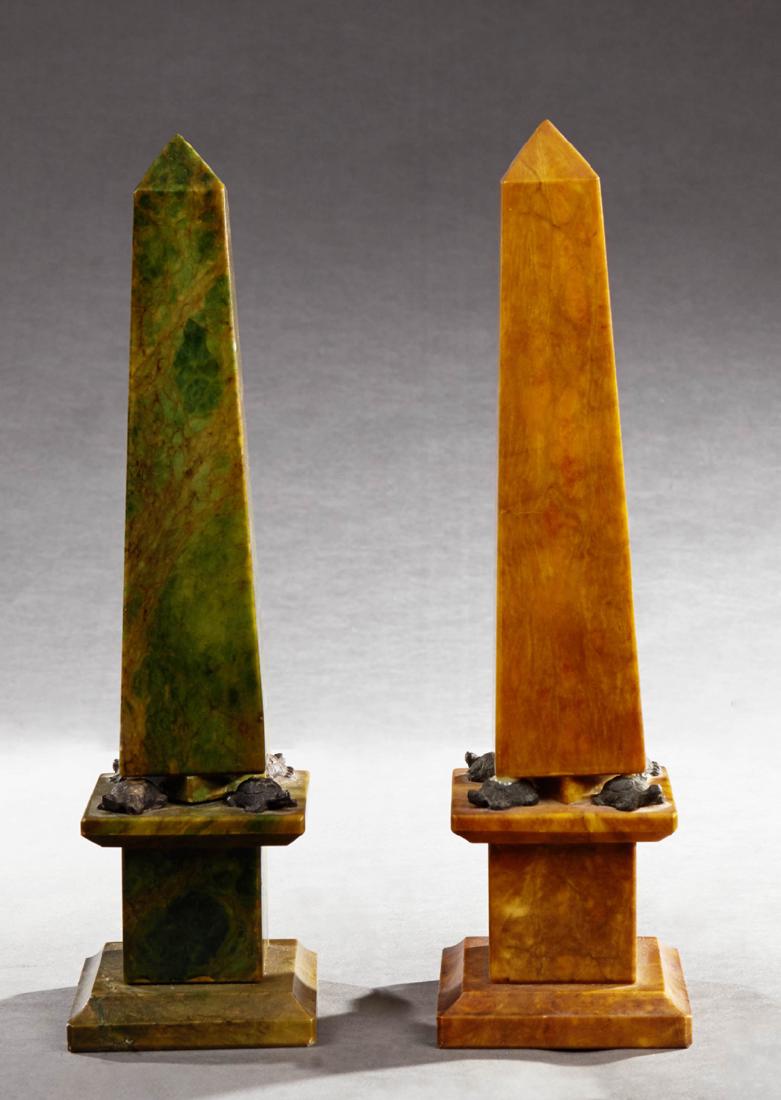 Pair of Carved Marble Obelisks, 20th c., one of figured: Pair of Carved Marble Obelisks, 20th c., one of figured green marble, the second of ocher marble, on turtle feet to a stepped base, H.- 13 3/4 in., W.- 3 3/4 in., D.- 3 3/4 in.