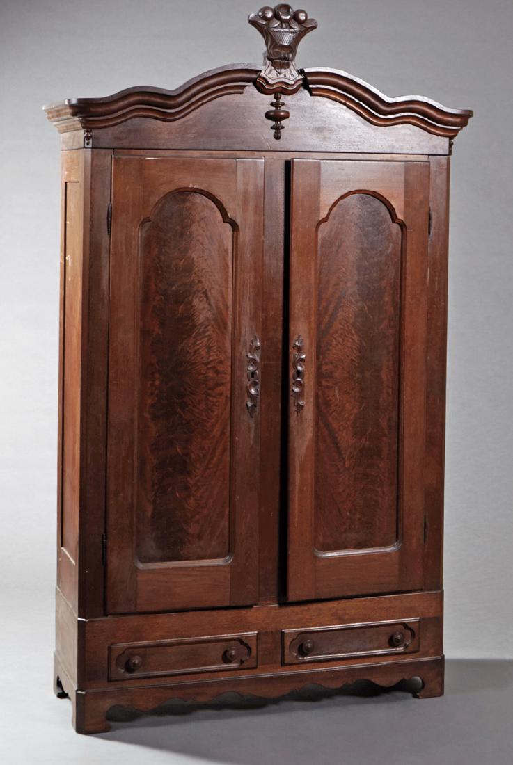 American Victorian Carved Walnut Armoire, c. 1890, the