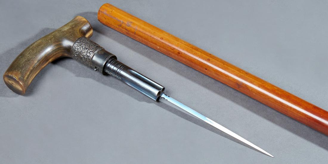 Rare Pepper Box Dagger Gun Cane, 19th c., the horn: Rare Pepper Box Dagger Gun Cane, 19th c., the horn handle with a silver collar enclosing a four shot pepper box pistol, with a central four sided dagger, atop a malacca shaft, with a brass tip, H.- 35