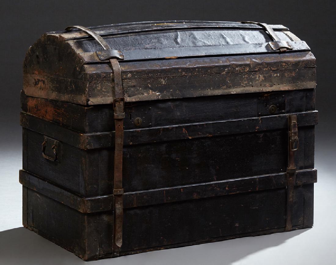 French Poplar Humpback Travel Trunk, 19th c., with: French Poplar Humpback Travel Trunk, 19th c., with leather straps and iron tacking, the lid with an oval brass plate "Ornon, J. a Angouleme," H.- 26 1/2 in., W.- 34 1/2 in., D.- 20 in.