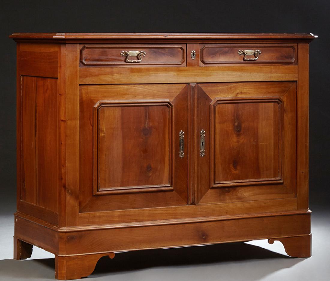 French Louis Philippe Style Carved Cherry Sideboard,: French Louis Philippe Style Carved Cherry Sideboard, 19th c., the plank top with a canted corner stepped edge above two frieze drawers over setback double cupboard doors, on a plinth base with bracket