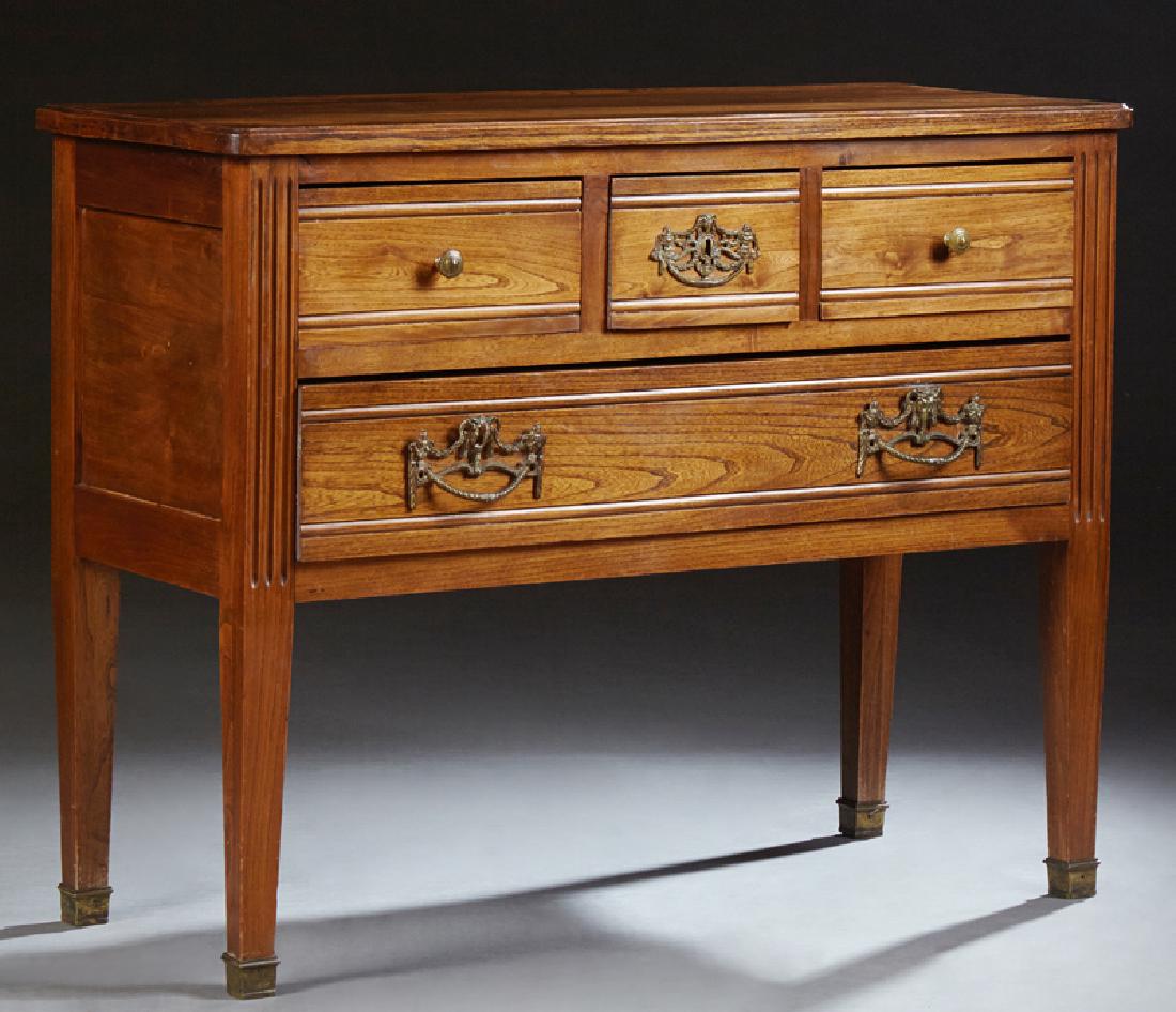 French Louis XVI Style Carved Oak Commode, late 19th: French Louis XVI Style Carved Oak Commode, late 19th c., the rounded corner top over three frieze drawers and a long lower drawer, flanked by reeded pilasters, on tapered square legs with ormolu sabot