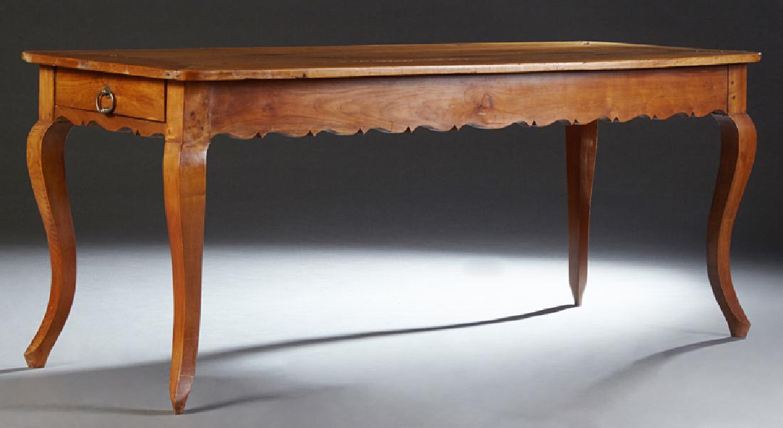 French Provincial Louis XV Style Carved Cherry: French Provincial Louis XV Style Carved Cherry Farmhouse Table, 19th c., the rounded corner top over a wide serpentine skirt with one end drawer, on cabriole legs with pointed toes, H.- 29 1/2 in., W.