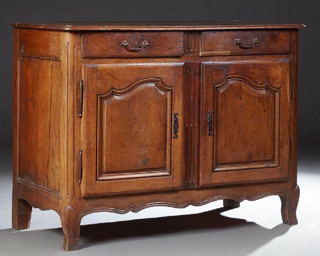 French Louis XV Style Carved Sideboard, 19th c., the: French Louis XV Style Carved Sideboard, 19th c., the stepped edge rounded corner top above two frieze drawers over two arched fielded panel cupboard doors with iron escutcheons and fiche hinges center
