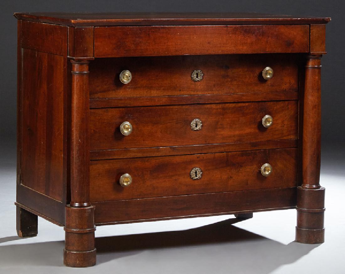 French Empire Style Carved Walnut Commode, c. 1840, the: French Empire Style Carved Walnut Commode, c. 1840, the rectangular top above a frieze drawer over three setback drawers flanked by tapered columns, on turned cylindrical feet, H.- 36 1/2 in., W.- 45 