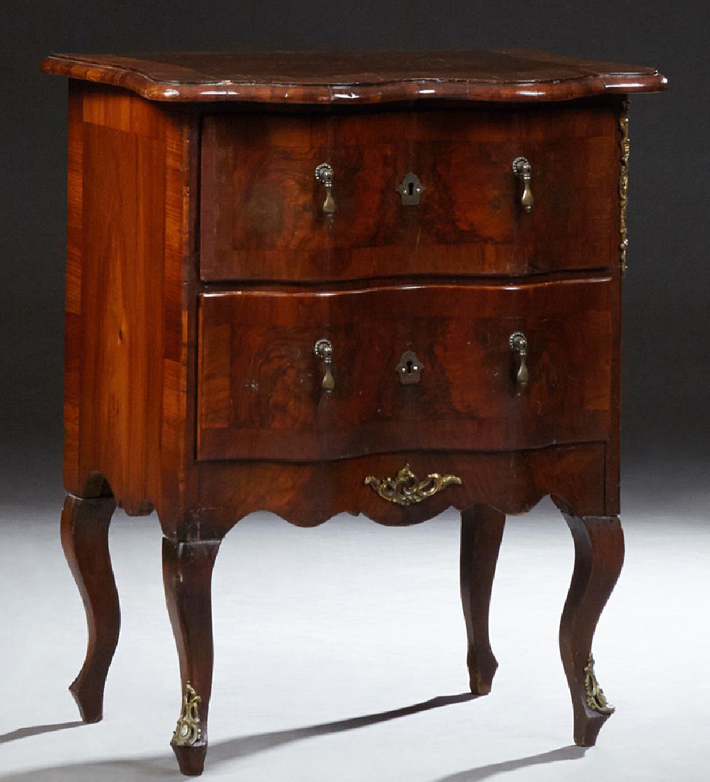 French Louis XV Style Crotched and Burled Mahogany: French Louis XV Style Crotched and Burled Mahogany Ormolu Mounted Diminutive Nightstand, late 19th c., the rounded edge serpentine top above two setback deep drawers flanked by ormolu mounts, on cabri