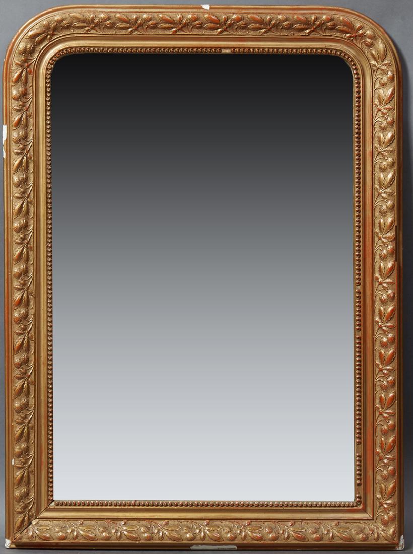 French Louis Philippe Style Gilt and Gesso Overmantle: French Louis Philippe Style Gilt and Gesso Overmantle Mirror, 19th c., the arched frame with relief leaf and berry decoration, around a beaded liner and a mirror plate, H.- 39 in., W.- 29 in., D.- 1 5