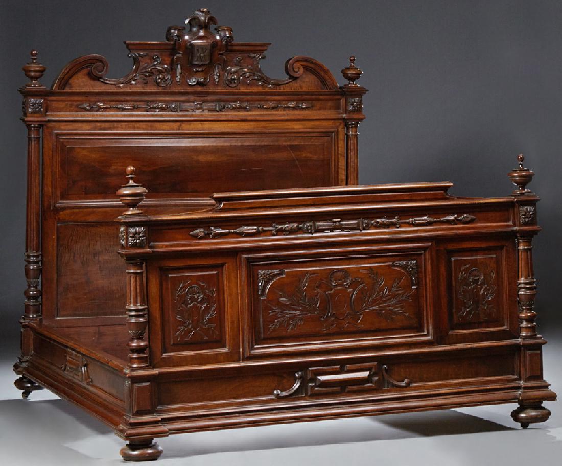 French Carved Walnut Louis XVI Style Double Bed, c.: French Carved Walnut Louis XVI Style Double Bed, c. 1890, the arched crest with a central monogram of "AV," flanked by turned finials, above a fielded panel back flanked by turned tapered reeded suppo