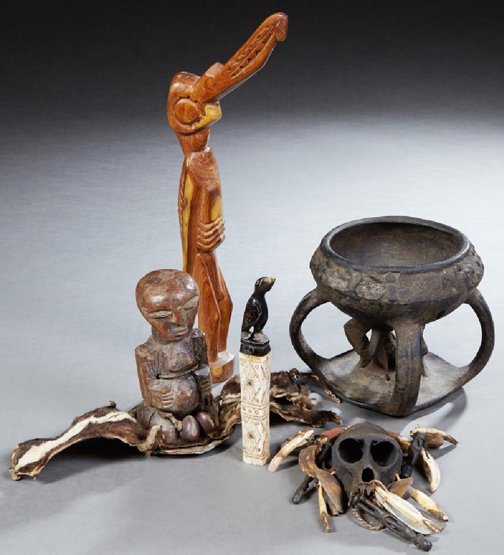 Group of Five Figures, consisting of an African: Group of Five Figures, consisting of an African ceremonial pottery bowl; an African Songye fetish figure; a Borneo Dayak tribe power fetish with a monkey skull, tusks, bones, etc; an Easter Island bir