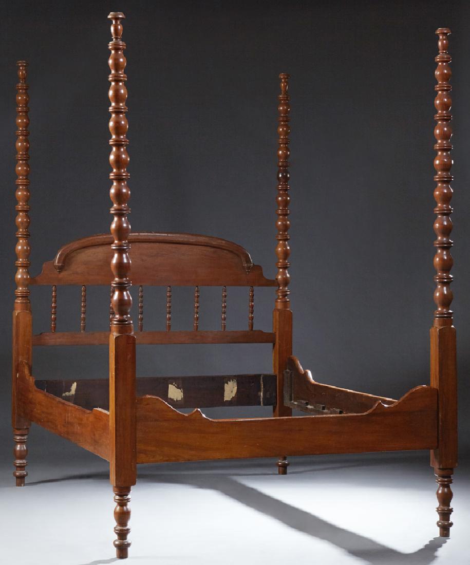 American Late Victorian Carved Walnut Four Poster Bed,: American Late Victorian Carved Walnut Four Poster Bed, c. 1880, the arched spindled headboard to shaped rails and a shaped footboard, with vasiform turned posts with block centers and vasiform turned