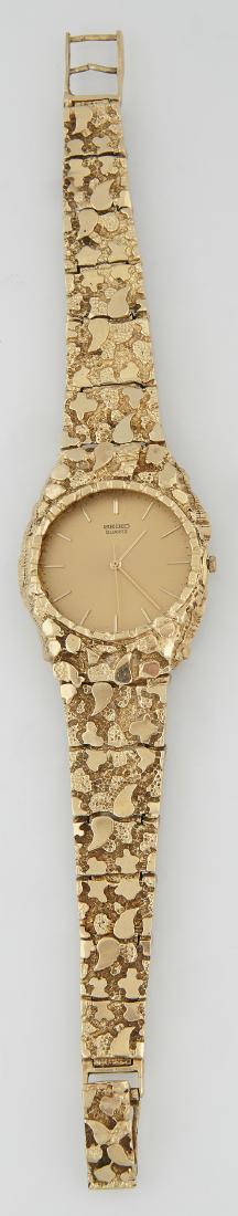 Man: Man's Seiko Quartz Wristwatch, Ser. # 672460, now mounted in an 18K yellow gold nugget link band, L.- 8 1/4 in., Wt. with Movement- 1.55 Troy Oz. Provenance: Property Seized by the New Orleans Police 