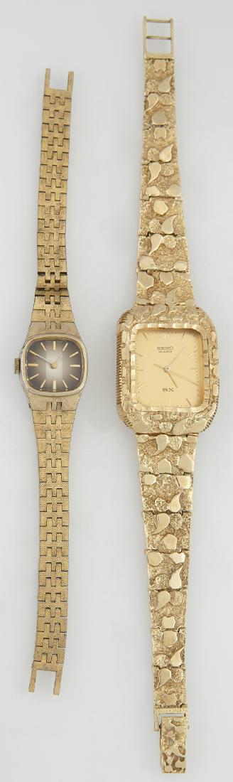 Two Seiko Quartz Wristwatches, on a man (1 of 2)