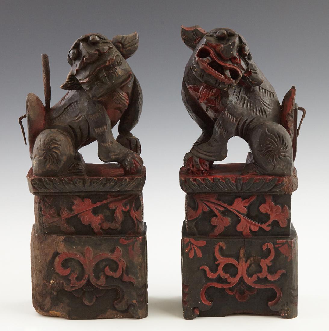 Pair of Chinese Ebonized Carved Wood Foo Lion Figures, (1 of 1)