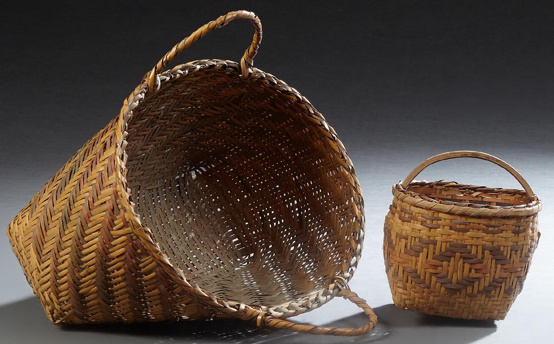 Two Cherokee Market Baskets, 20th c., both with natural: Two Cherokee Market Baskets, 20th c., both with natural dyes and handles, Largest- H. - 13 in., W. - 14 3/8 in., D. - 12 1/2 in.
