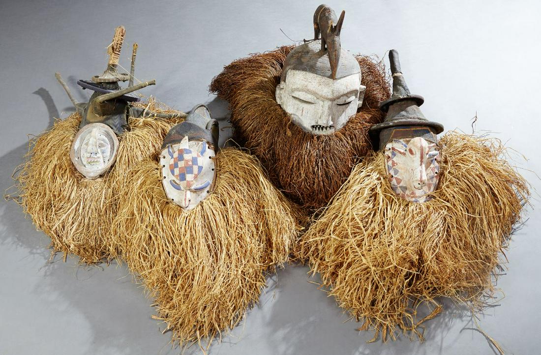 Group of Four Carved Polychromed Wood African Masks, (1 of 1)