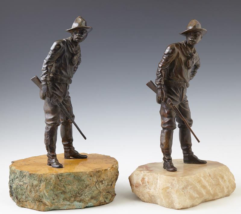 After Carl Kauba (1865-1922, Austrian), "Cowboy with a: After Carl Kauba (1865-1922, Austrian), "Cowboy with a Rifle," two patinated bronzes, signed on the rear of the cowboy's leg, mounted on thick marble bases, Figure- H.- 9 3/8 in., W.- 4 in., D.- 3 1/4