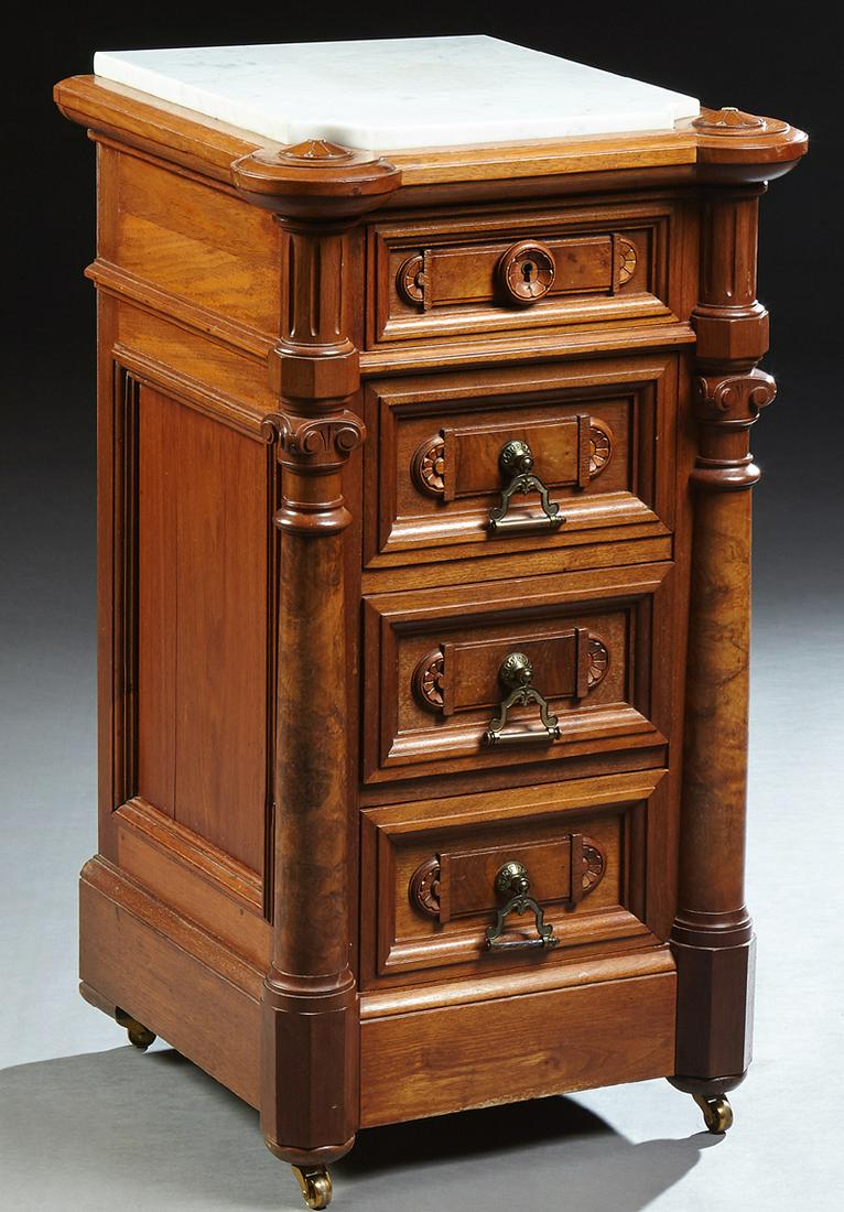 Renaissance Revival Carved Mahogany Marble Top: Renaissance Revival Carved Mahogany Marble Top Nightstand, 20th c., the inset white figured marble in a floral carved cookie corner top, over a setback frieze drawer and three deep drawers, flanked by