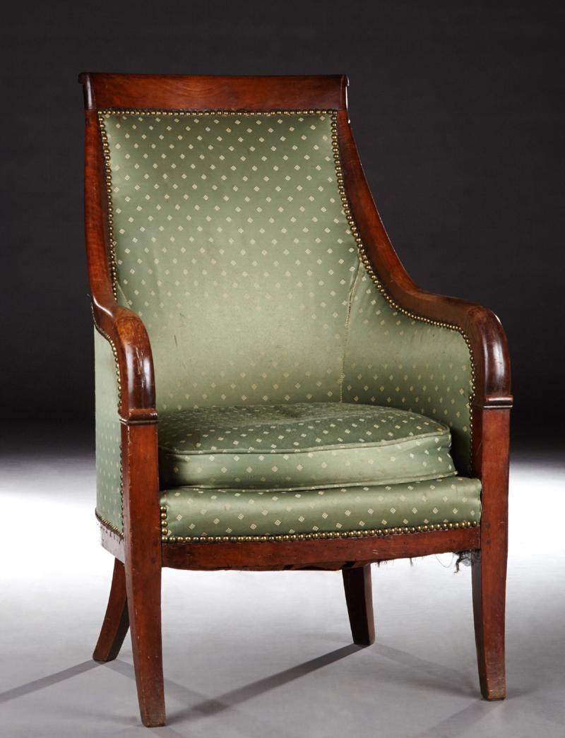 French Louis Philippe Style Carved Mahogany Bergere,: French Louis Philippe Style Carved Mahogany Bergere, late 19th c., the scrolled crest rail over sloping curved arms, to a bowed cushion seat on saber legs, in green silk upholstery with diamond decora