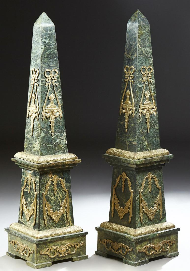 Monumental Pair of Bronze Ormolu Mounted Verde Antico: Monumental Pair of Bronze Ormolu Mounted Verde Antico Marble Obelisks, 20th/21st c., the tapering top with flaming urn and bow mounts, over a stepped plinth with floral garland and drapery mounts, to