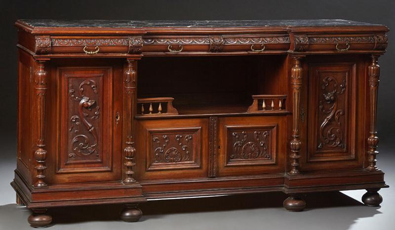American Henri II Style Carved Mahogany Marble Top: American Henri II Style Carved Mahogany Marble Top Breakfront Sideboard, early 20th c., the inset highly figured black marble over two central demilune front drawers over setback open spindled storage
