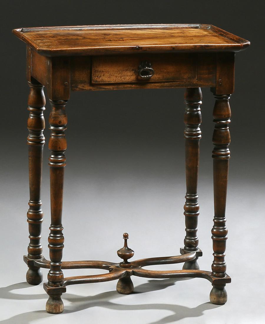 Unusual French Provincial Louis XIV Style Carved Beech: Unusual French Provincial Louis XIV Style Carved Beech Writing Table, 19th c., the canted corner galleried top over a frieze drawer, on turned tapered legs joined by a stylized X-form stretcher with a