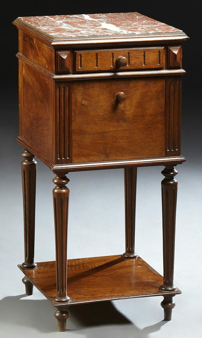 French Henri II Style Carved Walnut Marble Top: French Henri II Style Carved Walnut Marble Top Nightstand, early 20th c., the inset highly figured brown marble over a reeded front frieze drawer over a fall front pot cupboard, on turned tapered reed