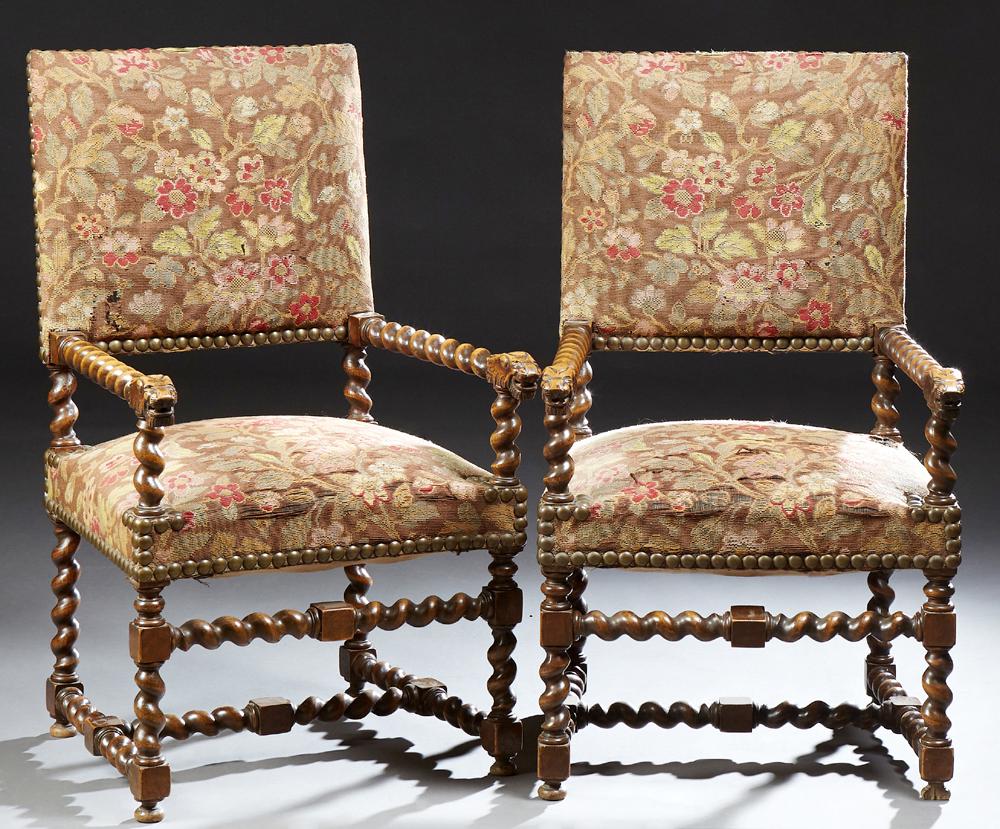 Pair of French Louis XIII Style Carved Beech Fauteuils,: Pair of French Louis XIII Style Carved Beech Fauteuils, early 20th c., the rectangular upholstered back over rope twist arms with lion head terminals, in period floral velvet upholstery with iron tack