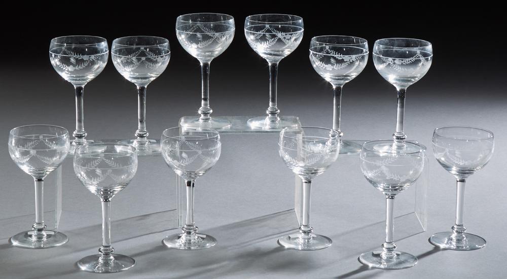 Twelve French Etched Crystal Wine Glasses, early 20th: Twelve French Etched Crystal Wine Glasses, early 20th c., consisting of 9 red wines, and 3 white wines, with floral and leaf decoration, (12 Pcs.)