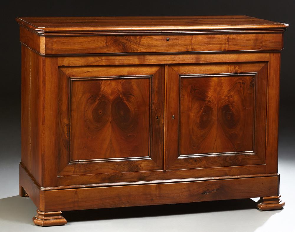 French Provincial Louis XV Style Carved Walnut: French Provincial Louis XV Style Carved Walnut Sideboard, c. 1860, the canted corner top over a long frieze drawer above double cupboard doors and a bottom "secret" drawer, on a plinth base on stepped