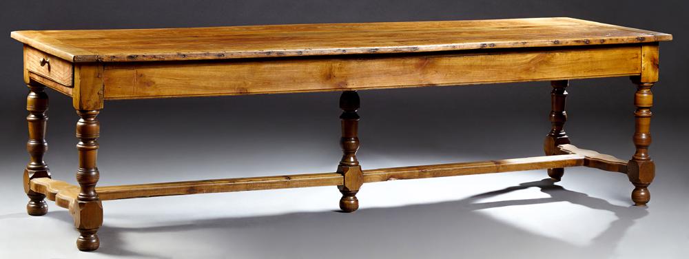 Exceptional French Carved Cherry Farmhouse Table, 19th: Exceptional French Carved Cherry Farmhouse Table, 19th c., the rectangular top over a wide skirt with one end drawer, on turned tapered block trestle legs, joined by an H-form stretcher, H. - 29 1/4 i