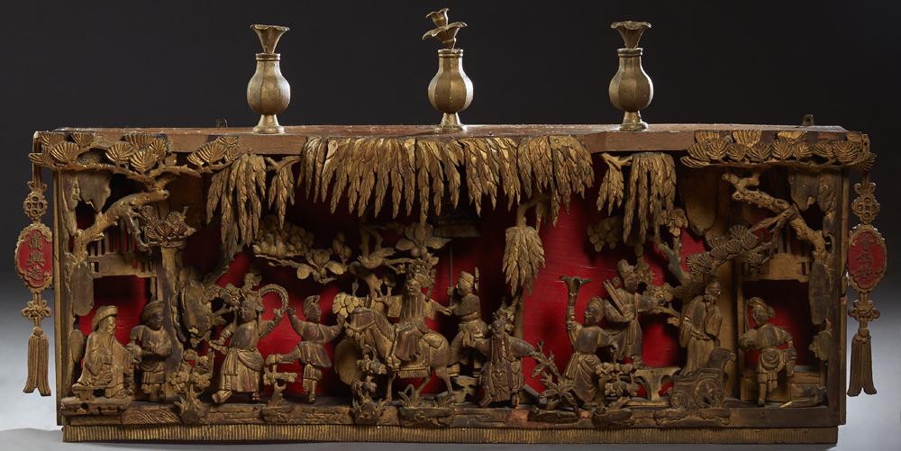 Chinese Carved Giltwood Architectural Frieze/Diorama,: Chinese Carved Giltwood Architectural Frieze/Diorama, Qing Dynasty (1644-1911), depicting figures in a procession with relief elements against a red ground, with an inscribed cartouche on either side 