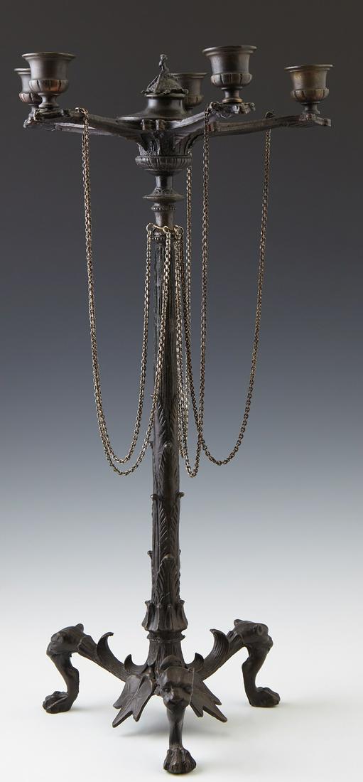 French Empire Style Patinated Bronze Candelabra, 19th: French Empire Style Patinated Bronze Candelabra, 19th c., with a central turtle finial, over five radiating arms with candlecups, joined by chains to the relief leaf decorated support, on tripodal lio