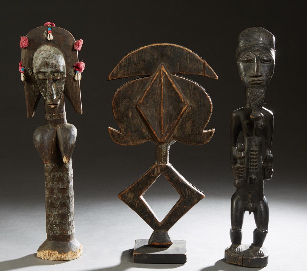 Group of Six Carved Wooden African Figures, 20th c., (1 of 20)