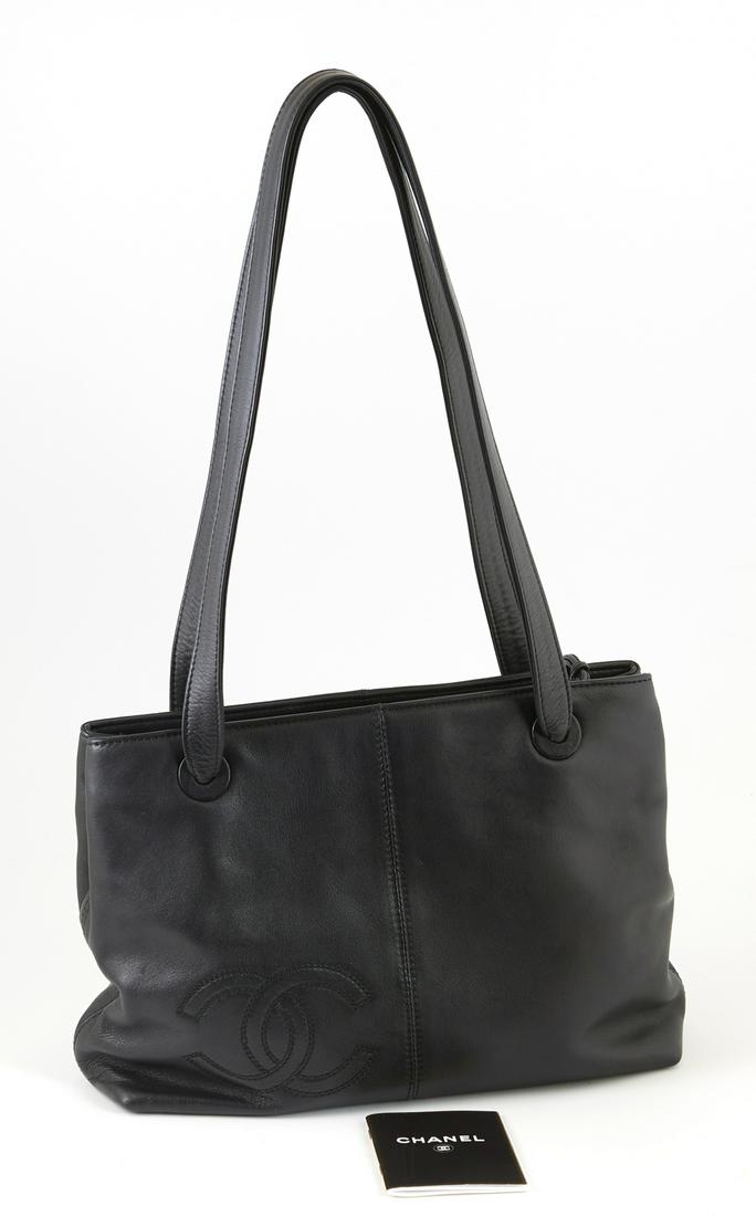 Chanel Black Small Grained Leather Front Logo Zip Tote,: Chanel Black Small Grained Leather Front Logo Zip Tote, c. 1997-1999, opening to a double black lined interior, both sides with a small zip compartment, Serial # 5508758, H.- 9 in., W.- 13 in., D.- 4
