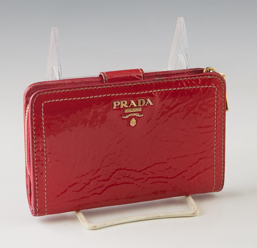 Prada Raspberry Patent Leather Wallet, with gold: Prada Raspberry Patent Leather Wallet, with gold hardware and snap buckle closure, the interior lined in hot pink leather with numerous card slots and three larger pockets, with a zip closure coin pur