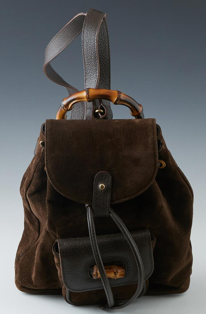 Vintage Gucci Chocolate Suede Mini Backpack, with: Vintage Gucci Chocolate Suede Mini Backpack, with gold-tone hardware, the peg hole and leather drawstring closure opening to a tan woven interior with a single zip pocket, the front exterior of the ba