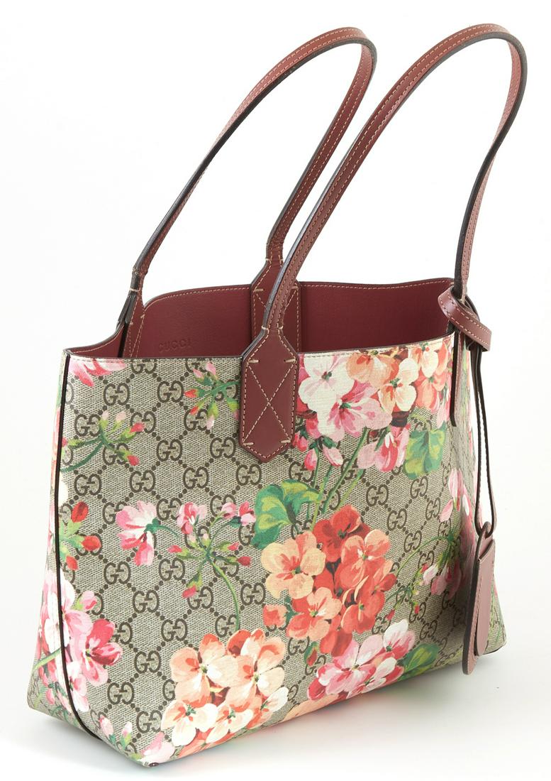Gucci Blooms Supreme Beige Coated Canvas Reversible: Gucci Blooms Supreme Beige Coated Canvas Reversible Tote Shoulder Bag, the exterior with a floral print and plum colored leather and luggage tag, opening to a large open plum colored interior, accompa