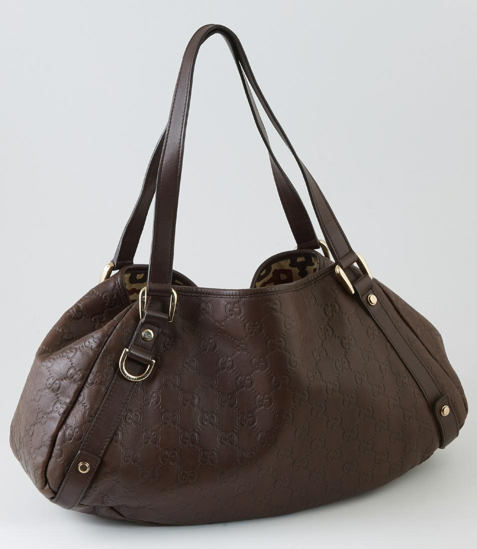 Gucci Dark Brown Leather Abbey Hobo Handbag, with brown: Gucci Dark Brown Leather Abbey Hobo Handbag, with brown leather double handles and gold hardware, the interior of the bag lined in a tricolor equestrian bit pattern, with an open cell phone pocket on 