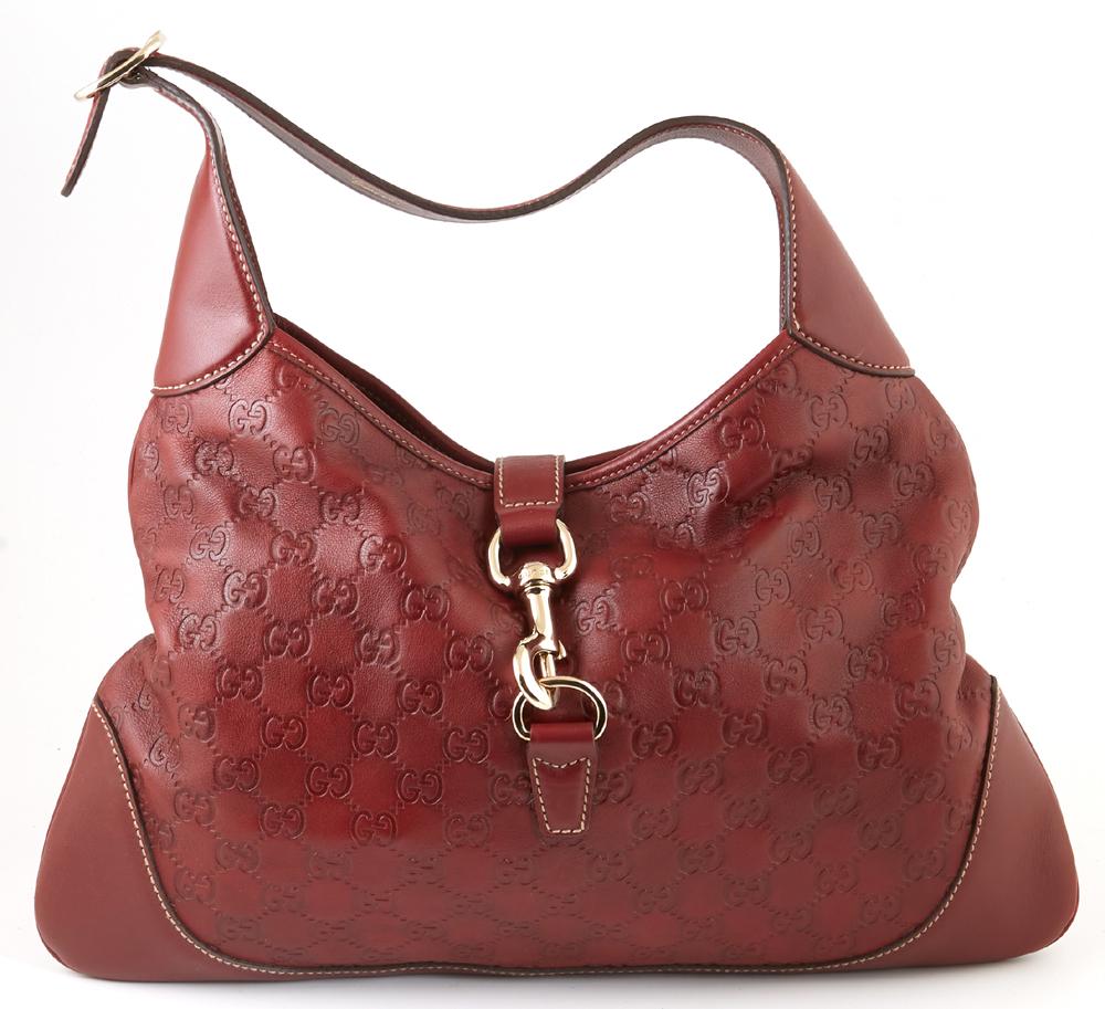 Gucci Dark Red Guccissima Leather Jackie O Hook Closure: Gucci Dark Red Guccissima Leather Jackie O Hook Closure Shoulder Bag, the adjustable strap with gold hardware and leather flap with a gold swivel clasp, opening to a red and green horse-bit motif line