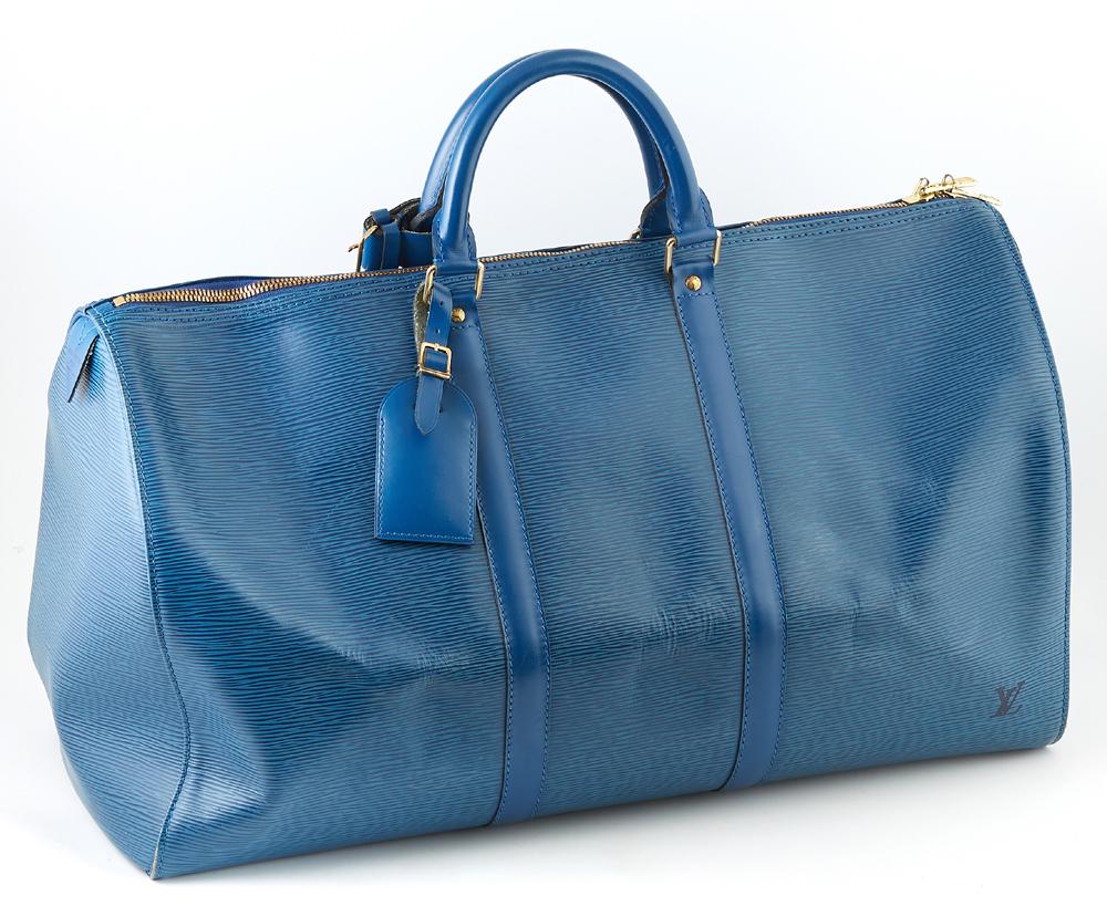 Louis Vuitton Keepall Blue Epi Calf Leather 50 Travel: Louis Vuitton Keepall Blue Epi Calf Leather 50 Travel Bag, with golden brass hardware, opening to a blue suede interior, the exterior with an open side pouch and luggage tag, H.- 12 in., W.- 21 in., D