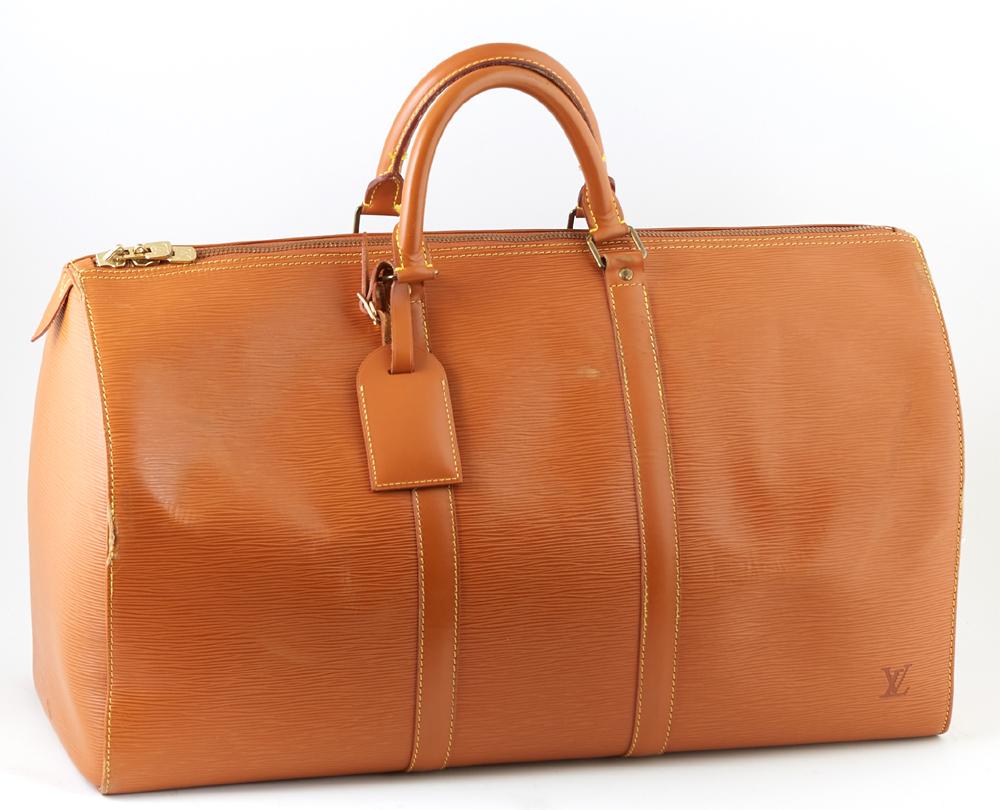 Louis Vuitton Keepall Brown Epi Calf Leather 50 Travel: Louis Vuitton Keepall Brown Epi Calf Leather 50 Travel Bag, with golden brass hardware, opening to a brown suede interior, the exterior with an open side pouch and luggage tag, H.- 12 in., W.- 21 in.,