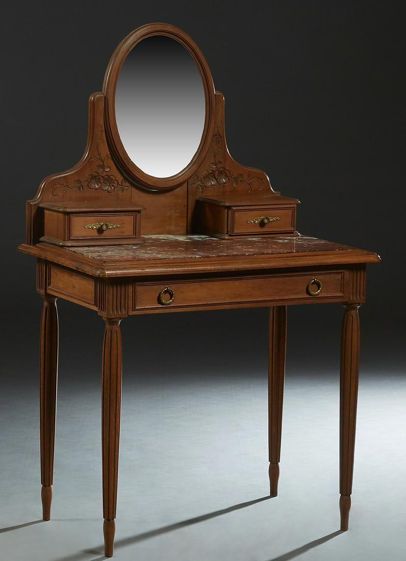French Art Nouveau Carved Walnut Marble Top Dressing: French Art Nouveau Carved Walnut Marble Top Dressing Table, c. 1900, with an oval beveled swivel mirror flanked by floral carving and small drawers, on a base with an inset highly figured brown marble