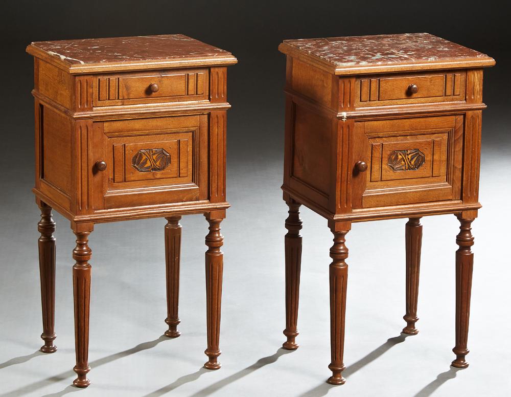Pair of Louis Philippe Carved Walnut Marble Top: Pair of Louis Philippe Carved Walnut Marble Top Nightstands, 19th c., the inset highly figured brown marble over a frieze drawer and a pot cupboard, on turned tapered reeded legs, H.- 28 1/2 in., W.- 